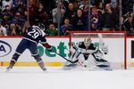 Mar 8, 2026; Denver, Colorado, USA; Colorado Avalanche center Nathan MacKinnon (29) scores a shootout goal against Minnesota Wild goaltender Jesper Wallstedt (30) at Ball Arena. Mandatory Credit: Isaiah J. Downing-Imagn Images