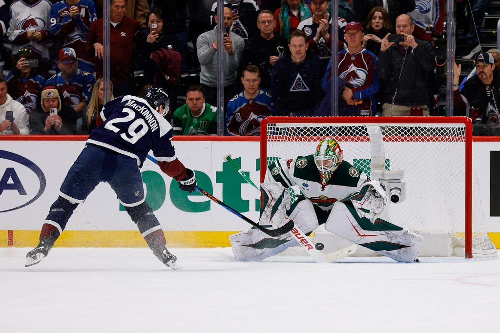 Mar 8, 2026; Denver, Colorado, USA; Colorado Avalanche center Nathan MacKinnon (29) scores a shootout goal against Minnesota Wild goaltender Jesper Wallstedt (30) at Ball Arena. Mandatory Credit: Isaiah J. Downing-Imagn Images