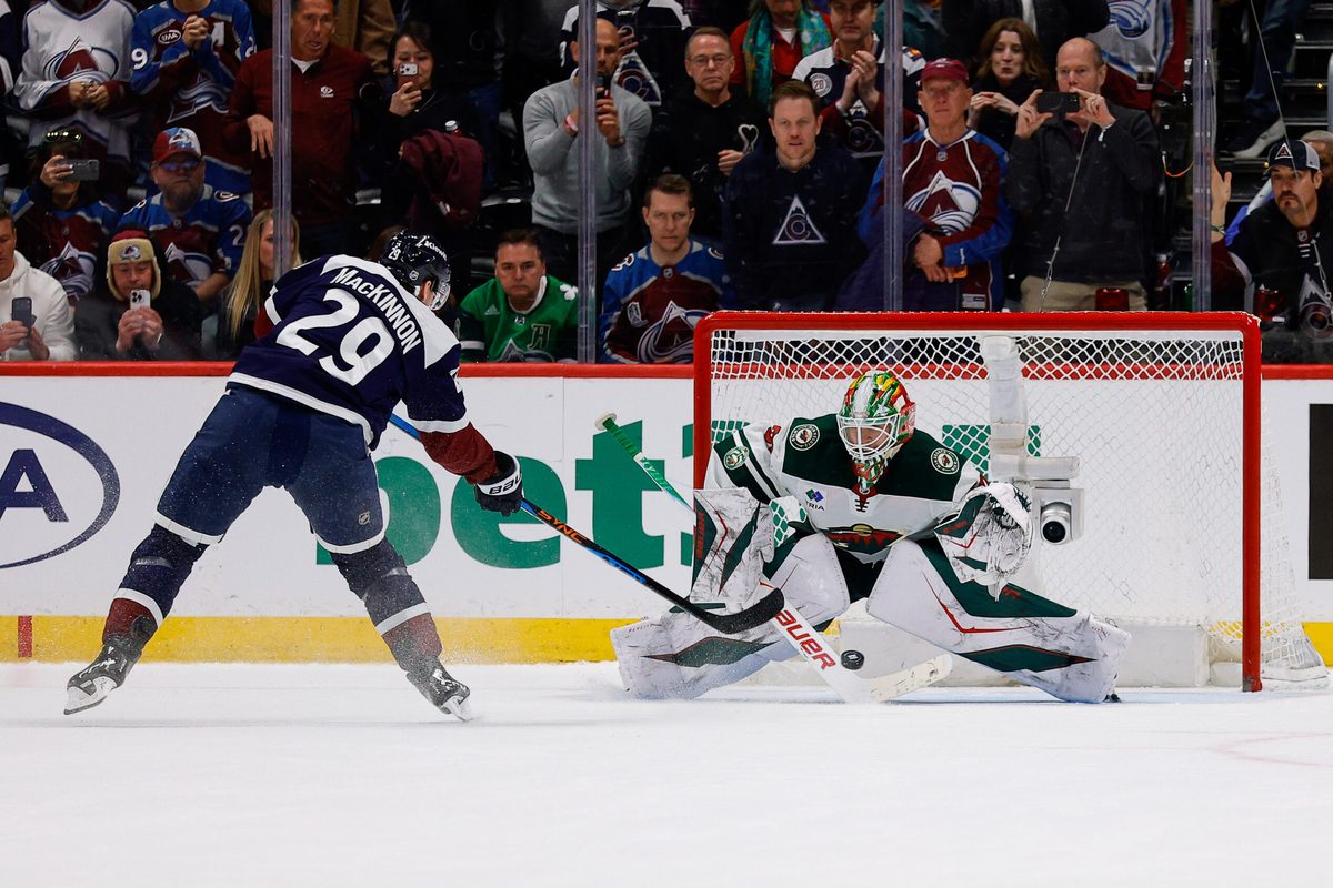 Mar 8, 2026; Denver, Colorado, USA; Colorado Avalanche center Nathan MacKinnon (29) scores a shootout goal against Minnesota Wild goaltender Jesper Wallstedt (30) at Ball Arena. Mandatory Credit: Isaiah J. Downing-Imagn Images