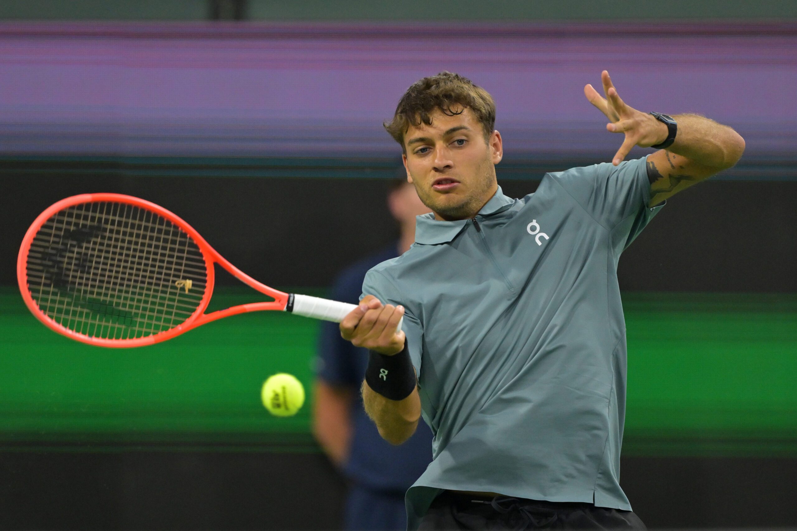 Mar 8, 2026; Indian Wells, CA, USA; Flavio Cobolli (ITA) hits a shot during his third round match against Frances Tiafoe (USA) in the BNP Paribas Open at the Indian Wells Tennis Garden. Mandatory Credit: Jayne Kamin-Oncea-Imagn Images