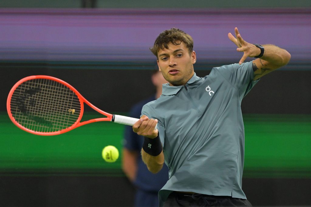 Mar 8, 2026; Indian Wells, CA, USA; Flavio Cobolli (ITA) hits a shot during his third round match against Frances Tiafoe (USA) in the BNP Paribas Open at the Indian Wells Tennis Garden. Mandatory Credit: Jayne Kamin-Oncea-Imagn Images