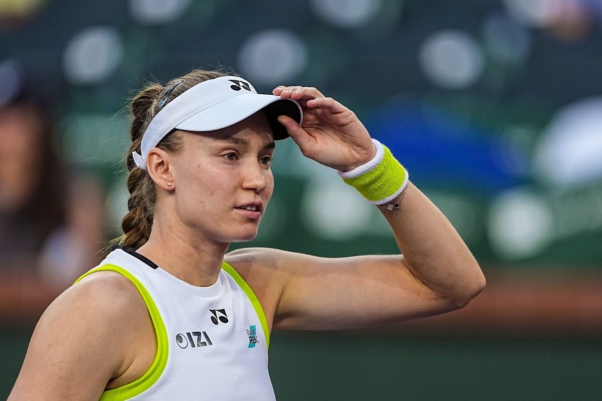 Elena Rybakina adjusts her visor after warming up with Elina Svitolina for their semifinal match at the BNP Paribas Open in Indian Wells, Calif., Friday, March 13, 2026.