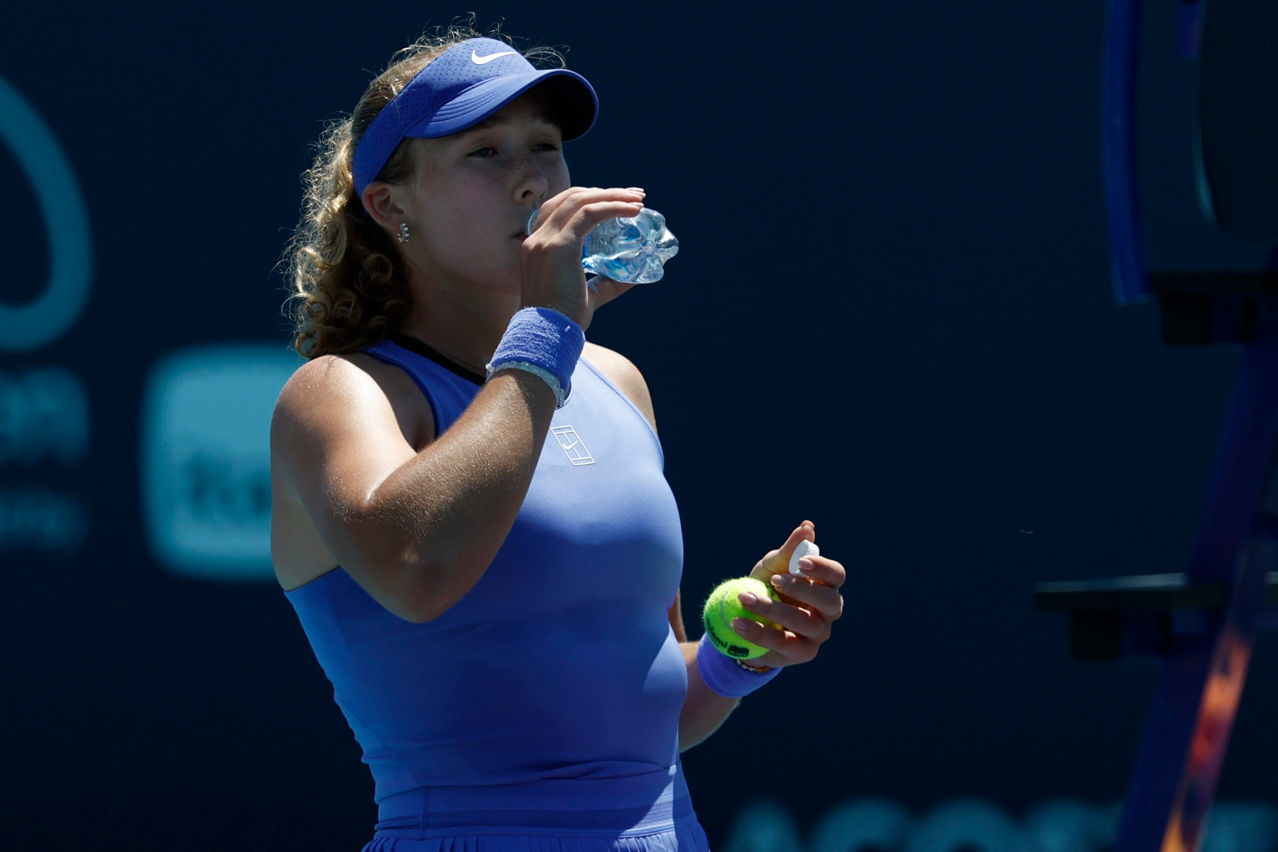 Mar 23, 2026; Miami Gardens, FL, USA; Mirra Andreeva takes a drink of water during a changeover against Victoria Mboko (CAN) (not pictured) on day 7 of the 2026 Miami Open at Hard Rock Stadium. Mandatory Credit: Geoff Burke-Imagn Images