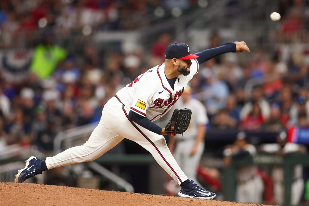 Mar 31, 2026; Atlanta, Georgia, USA; Atlanta Braves relief pitcher Martin Perez (33) throws against the Athletics in the sixth inning at Truist Park. Mandatory Credit: Brett Davis-Imagn Images