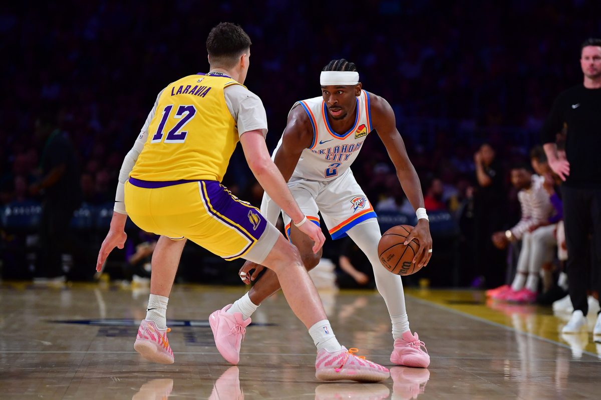 April 7, 2026; Los Angeles, California, USA; Oklahoma City Thunder guard Shai Gilgeous-Alexander (2) moves the ball against Los Angeles Lakers forward Jake LaRavia (12) during the second half at Crypto.com Arena. Mandatory Credit: Gary A. Vasquez-Imagn Images
