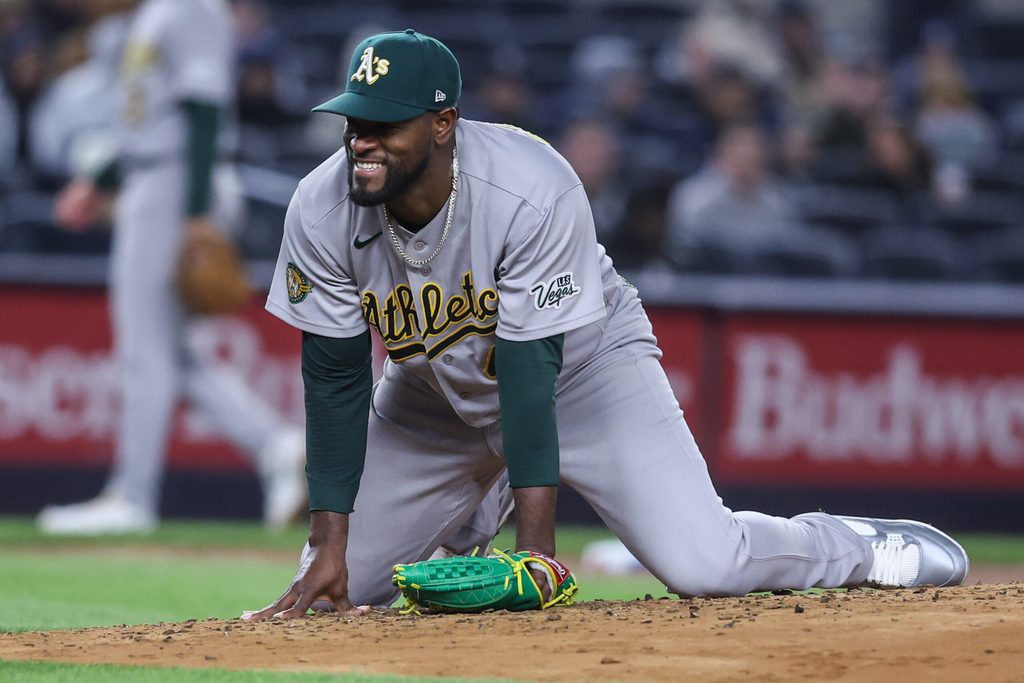 Apr 8, 2026; Bronx, New York, USA; Athletics starting pitcher Luis Severino (40) reacts after almost getting hit by the ball in the third inning against the New York Yankees at Yankee Stadium. Mandatory Credit: Wendell Cruz-Imagn Images