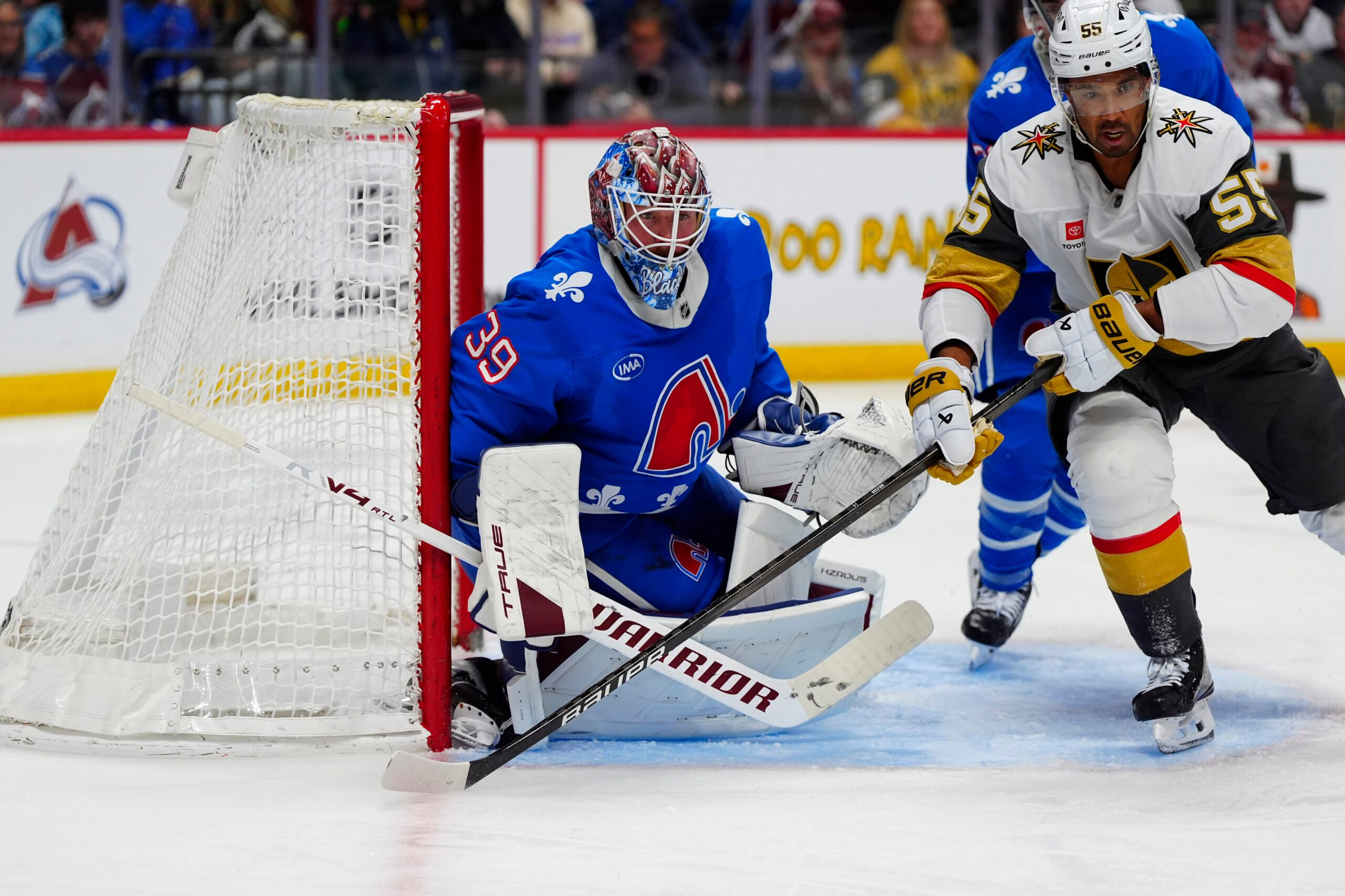 Apr 11, 2026; Denver, Colorado, USA; Vegas Golden Knights right wing Keegan Kolesar (55) and Colorado Avalanche goaltender MacKenzie Blackwood (39) during the third period at Ball Arena. Mandatory Credit: Ron Chenoy-Imagn Images
