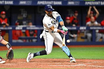 Apr 21, 2026; St. Petersburg, Florida, USA; Tampa Bay Rays infielder Yandy Diaz (2) hits during the eighth inning against Cincinnati Reds at Tropicana Field. Mandatory Credit: Pablo Robles-Imagn Images