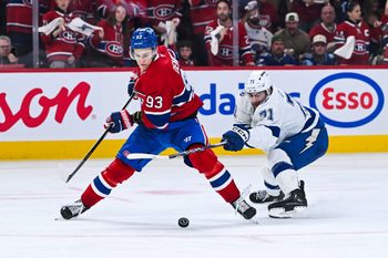 Apr 26, 2026; Montreal, Quebec, CAN; Montreal Canadiens right wing Ivan Demidov (93) plays the puck against Tampa Bay Lightning center Anthony Cirelli (71) during the third period in game four of the first round of the 2026 Stanley Cup Playoffs at Bell Centre. Mandatory Credit: David Kirouac-Imagn Images
