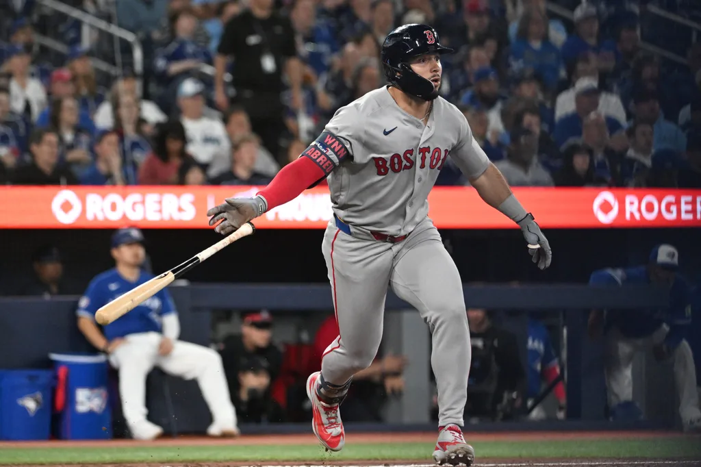 Apr 27, 2026; Toronto, Ontario, CAN; Boston Red Sox right fielder Wilyer Abreu (52) hits an RBI double against the Toronto Blue Jays in the fifth inning at Rogers Centre. Mandatory Credit: Dan Hamilton-Imagn Images