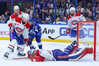 Apr 29, 2026; Tampa, Florida, USA; Montreal Canadiens goaltender Jakub Dobes (75) dives on the puck against the Tampa Bay Lightning in the third period during game five of the first round of the 2026 Stanley Cup Playoffs at Benchmark International Arena. Mandatory Credit: Nathan Ray Seebeck-Imagn Images