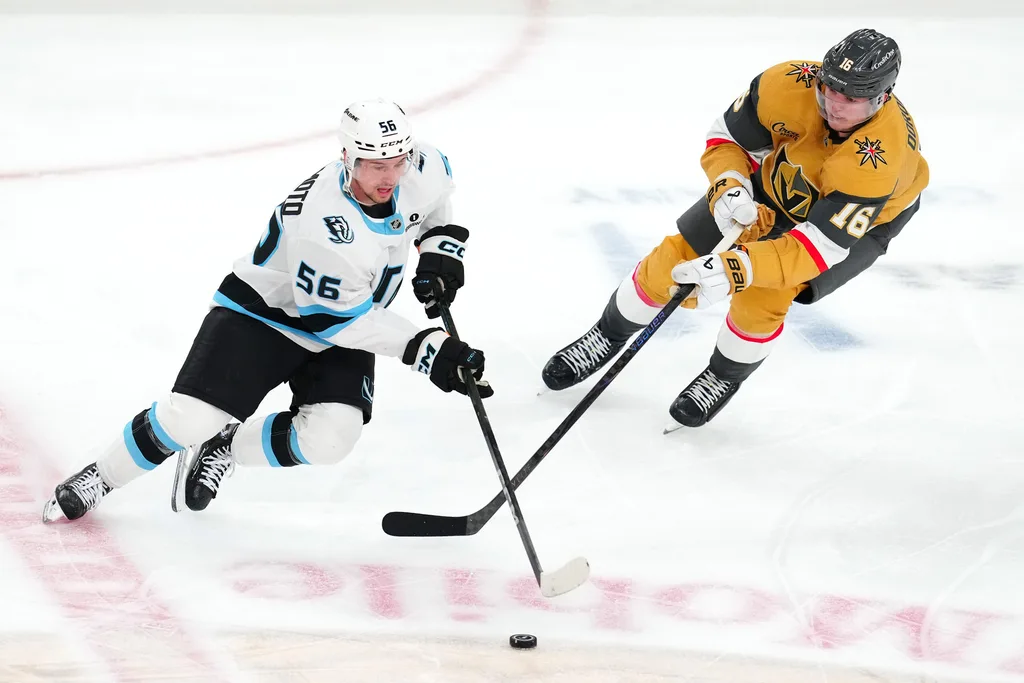 Apr 29, 2026; Las Vegas, Nevada, USA; Utah Mammoth right wing Kailer Yamamoto (56) skates around Vegas Golden Knights right wing Pavel Dorofeyev (16) during the first overtime period of game five of the first round of the 2026 Stanley Cup Playoffs at T-Mobile Arena. Mandatory Credit: Stephen R. Sylvanie-Imagn Images