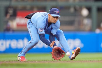 Apr 30, 2026; Minneapolis, Minnesota, USA; Toronto Blue Jays shortstop Andrés Giménez (0) fields a ground ball by Minnesota Twins second baseman Luke Keaschall (15) in the fifth inning at Target Field. Mandatory Credit: Matt Blewett-Imagn Images