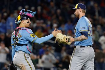 May 1, 2026; Washington, District of Columbia, USA; Milwaukee Brewers catcher William Contreras (24) celebrates with Brewers relief pitcher Easton McGee (50) after the final out against the Washington Nationals at Nationals Park. Mandatory Credit: Geoff Burke-Imagn Images