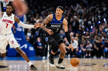 May 1, 2026; Orlando, Florida, USA; Orlando Magic forward Paolo Banchero (5) dribbles the ball against Detroit Pistons forward Paul Reed (7) in the fourth quarter during game six of the first round of the 2026 NBA Playoffs at Kia Center. Mandatory Credit: Jeremy Reper-Imagn Images