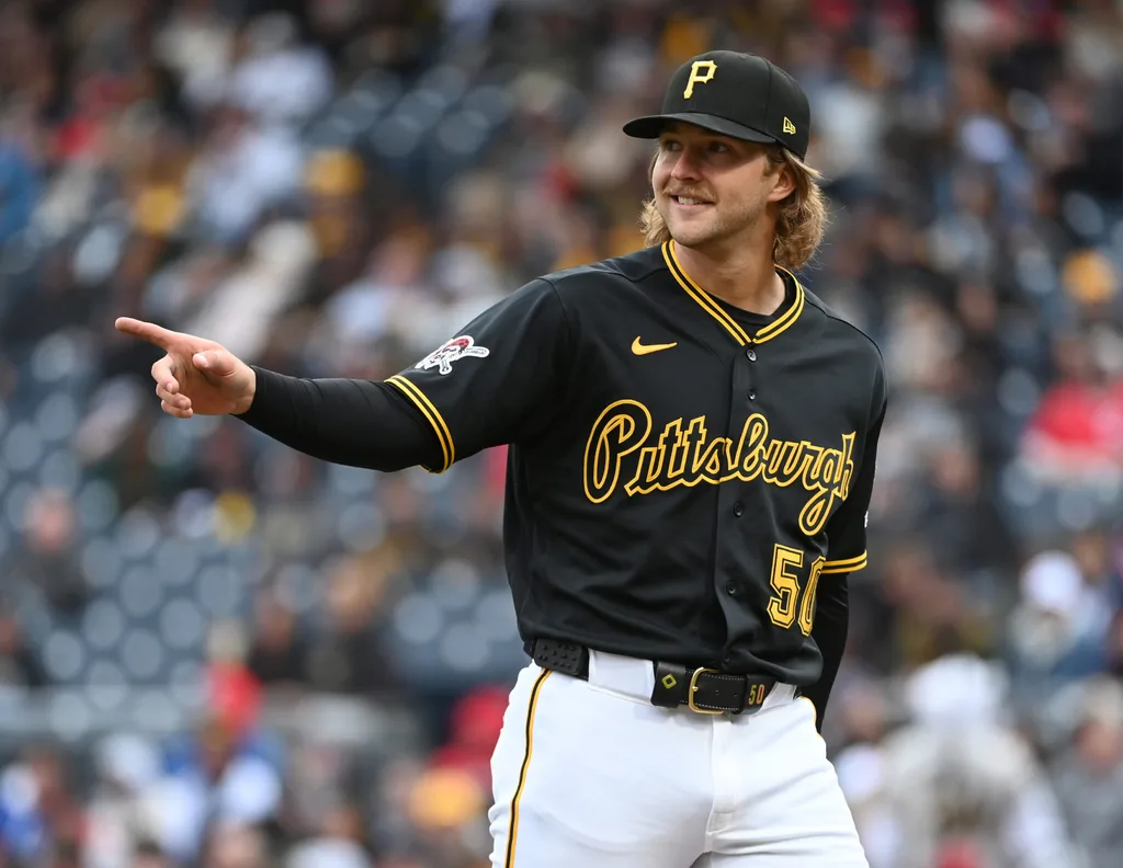 May 2, 2026; Pittsburgh, Pennsylvania, USA; Pittsburgh Pirates starting pitcher Carmen Mlodzinski gestures to center fielder Oneil Cruz after making a catch against the Cincinnati Reds to end the fourth inning at PNC Park. Mandatory Credit: Philip G. Pavely-Imagn Images