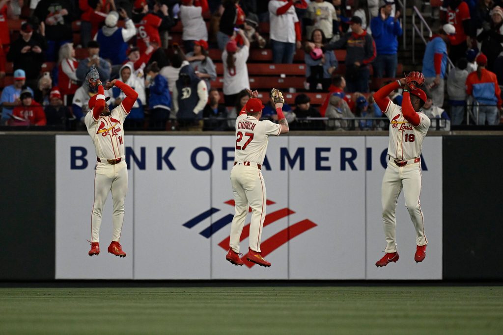 May 2, 2026; St. Louis, Missouri, USA; St. Louis Cardinals center fielder Victor Scott II (11), St. Louis Cardinals left fielder Nathan Church (27) and St. Louis Cardinals right fielder Jordan Walker (18) celebrate after beating the Los Angeles Dodgers at Busch Stadium. Mandatory Credit: Joe Puetz-Imagn Images