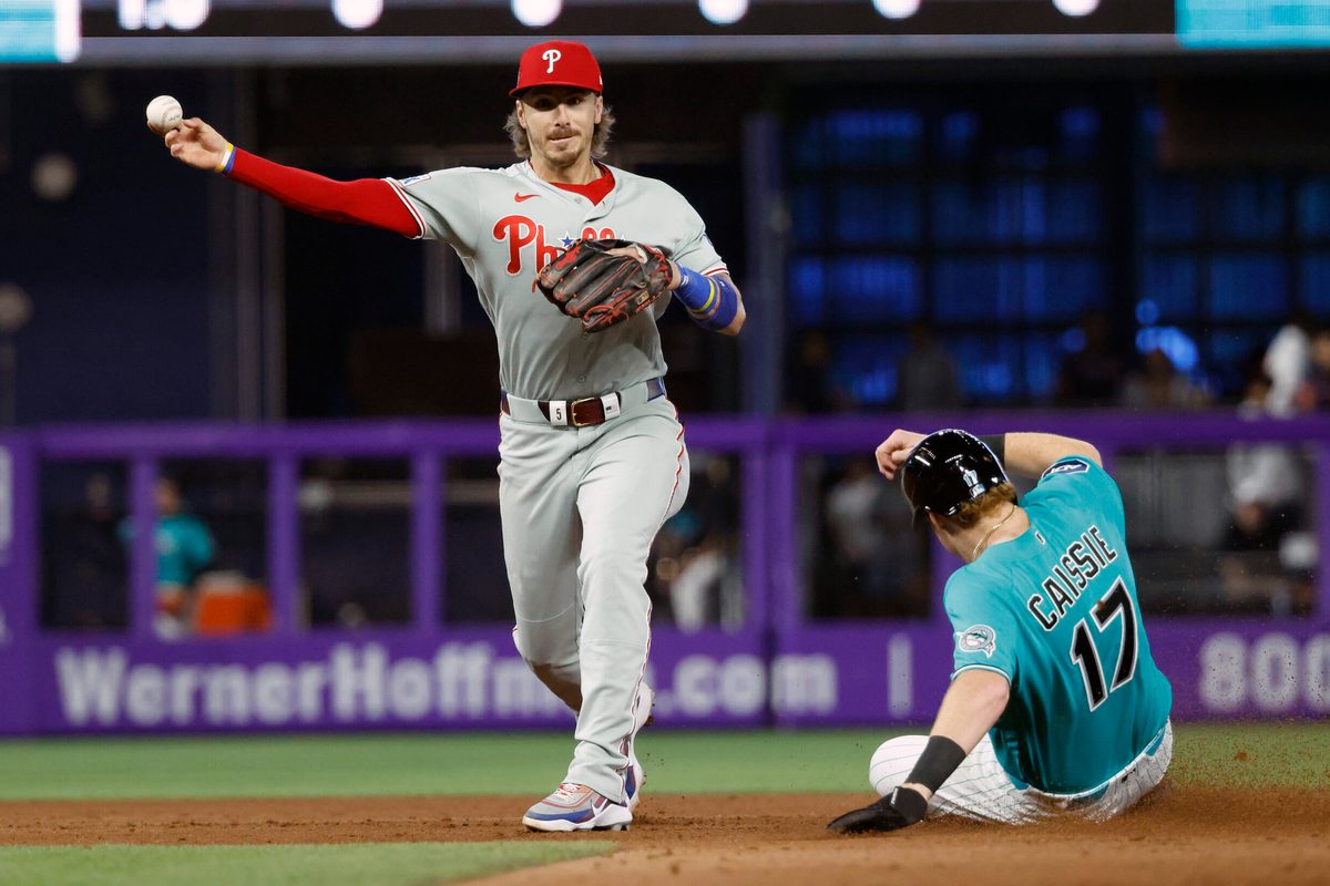 May 3, 2026; Miami, Florida, USA;  Miami Marlins right fielder Owen Caissie (17) is out at second base as Philadelphia Phillies second baseman Bryson Stott (5) throws to first for the double play during the eighth inning at loanDepot Park. Mandatory Credit: Rhona Wise-Imagn Images