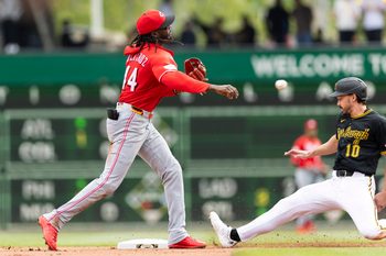 May 3, 2026; Pittsburgh, Pennsylvania, USA;  Cincinnati Reds shortstop Elly De La Cruz (44) makes the throw to complete a double play as Pittsburgh Pirates left fielder Bryan Reynolds (10) slides into second base during the seventh inning at PNC Park. Mandatory Credit: Scott Galvin-Imagn Images