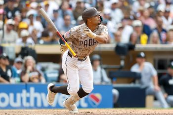 May 3, 2026; San Diego, California, USA; San Diego Padres shortstop Xander Bogaerts (2) hits a RBI infield single during the eighth inning against the Chicago White Sox at Petco Park. Mandatory Credit: David Frerker-Imagn Images