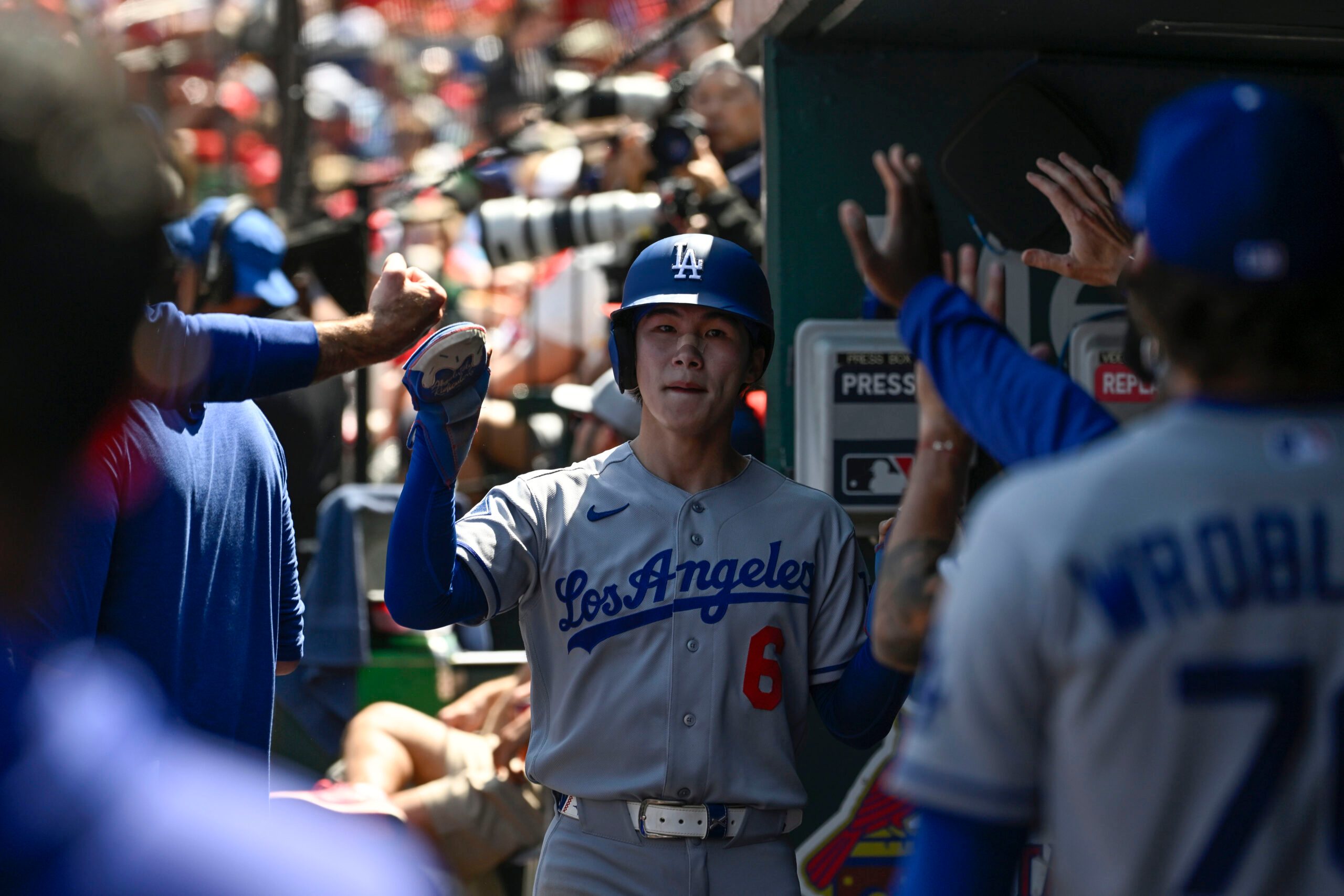 May 3, 2026; St. Louis, Missouri, USA; Los Angeles Dodgers shortstop Hyeseong Kim (6) is congratulated after scoring a run against the St. Louis Cardinals in the fifth inning at Busch Stadium. Mandatory Credit: Joe Puetz-Imagn Images