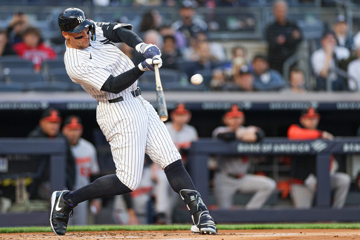 May 4, 2026; Bronx, New York, USA; New York Yankees right fielder Aaron Judge (99) hits a two run home run during the first inning against the Baltimore Orioles at Yankee Stadium. Mandatory Credit: Vincent Carchietta-Imagn Images