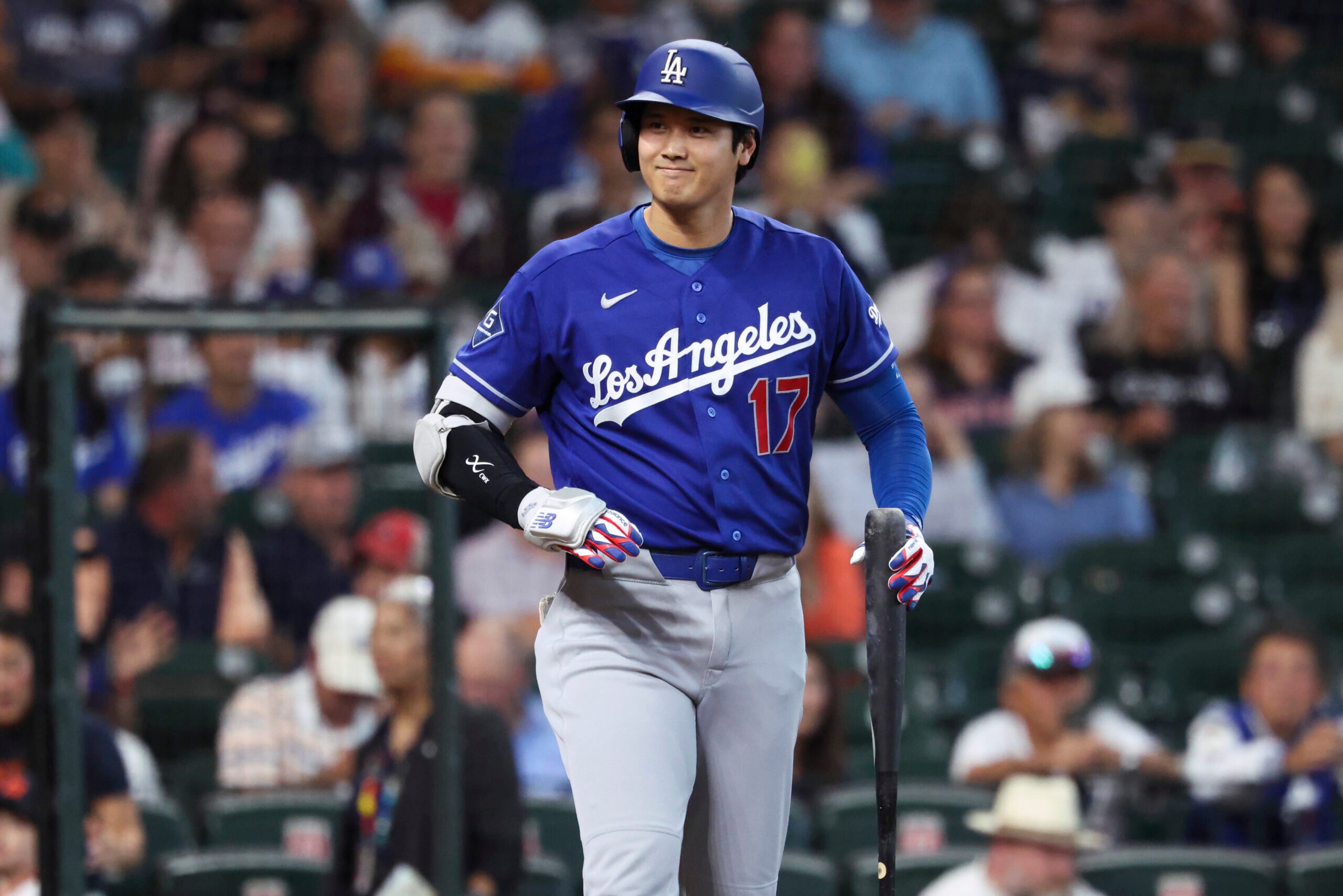 May 4, 2026; Houston, Texas, USA; Los Angeles Dodgers designated hitter Shohei Ohtani (17) smiles towards the Houston Astros dugout before batting during the first inning at Daikin Park. Mandatory Credit: Troy Taormina-Imagn Images