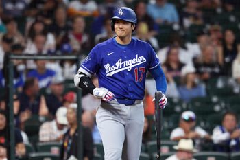 May 4, 2026; Houston, Texas, USA; Los Angeles Dodgers designated hitter Shohei Ohtani (17) smiles towards the Houston Astros dugout before batting during the first inning at Daikin Park. Mandatory Credit: Troy Taormina-Imagn Images