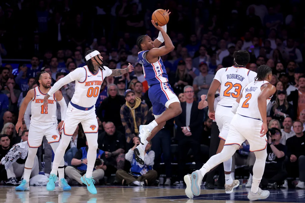 May 4, 2026; New York, New York, USA; Philadelphia 76ers guard Tyrese Maxey (0) looks to pass the ball against New York Knicks guards Jalen Brunson (11) and Jordan Clarkson (00) and center Mitchell Robinson (23) and guard Miles McBride (2) during the first quarter of game one of the eastern conference semifinal round of the 2026 NBA Playoffs at Madison Square Garden. Mandatory Credit: Brad Penner-Imagn Images