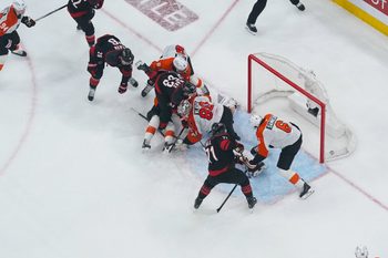 May 4, 2026; Raleigh, North Carolina, USA; Carolina Hurricanes left wing Taylor Hall (71) scores the game winning goal past Philadelphia Flyers goaltender Dan Vladar (80) and defenseman Travis Sanheim (6) during the first overtime in game two of the second round of the 2026 Stanley Cup Playoffs at Lenovo Center. Mandatory Credit: James Guillory-Imagn Images
