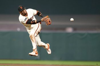 May 4, 2026; San Francisco, California, USA; San Francisco Giants second baseman Luis Arraez (1) throws the ball to first base against the San Diego Padres during the ninth inning at Oracle Park. Mandatory Credit: Kelley L Cox-Imagn Images