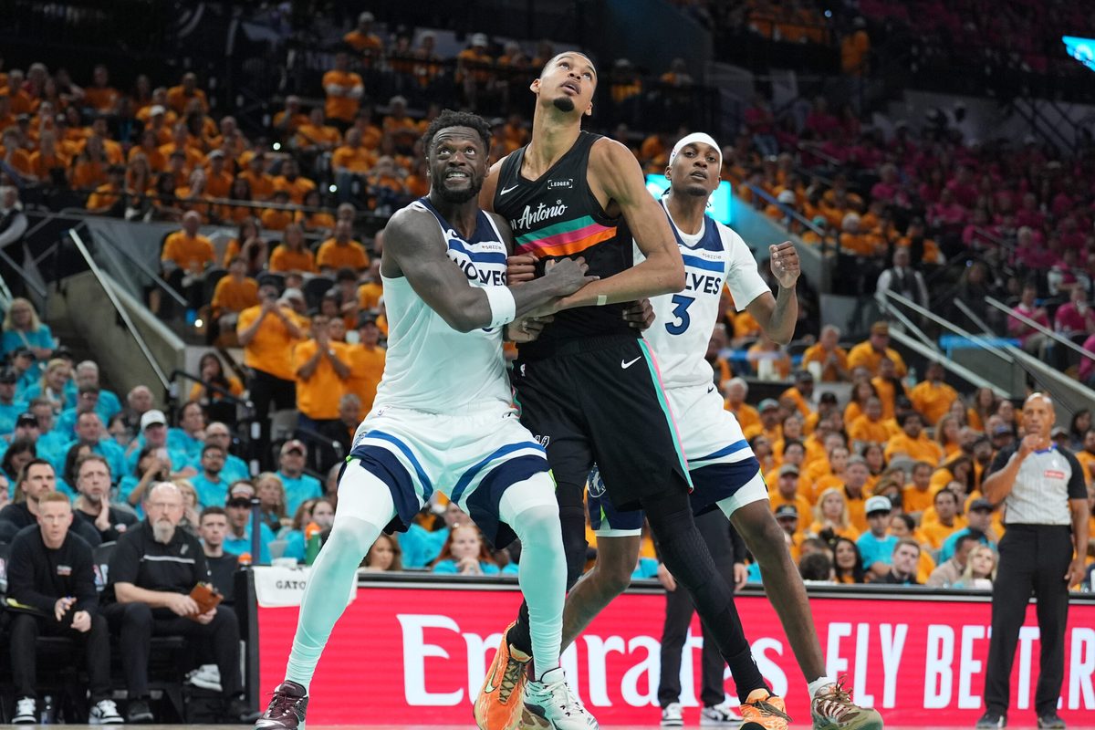 May 4, 2026; San Antonio, Texas, USA; Minnesota Timberwolves forwards Julius Randle (30) and Jaden McDaniels (3) try to keep San Antonio Spurs forward Victor Wembanyama (1) back in the second half during game one of the second round of the 2026 NBA Playoffs at Frost Bank Center. Mandatory Credit: Daniel Dunn-Imagn Images