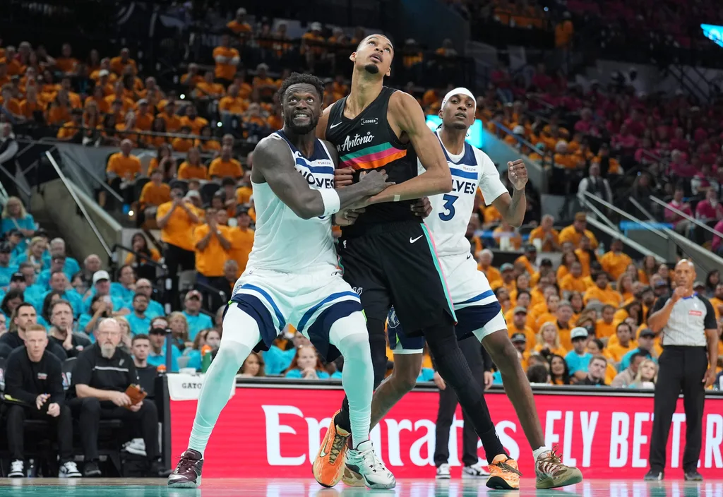 May 4, 2026; San Antonio, Texas, USA; Minnesota Timberwolves forwards Julius Randle (30) and Jaden McDaniels (3) try to keep San Antonio Spurs forward Victor Wembanyama (1) back in the second half during game one of the second round of the 2026 NBA Playoffs at Frost Bank Center. Mandatory Credit: Daniel Dunn-Imagn Images