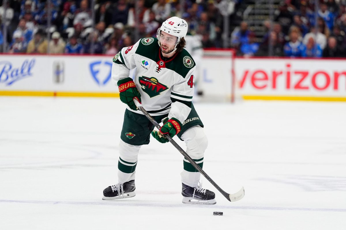 May 5, 2026; Denver, Colorado, USA; Minnesota Wild defenseman Quinn Hughes (43) prepares to shoot the puck against the Colorado Avalanche in game two of the second round of the 2026 Stanely Cup Playoffs at Ball Arena. Mandatory Credit: Ron Chenoy-Imagn Images