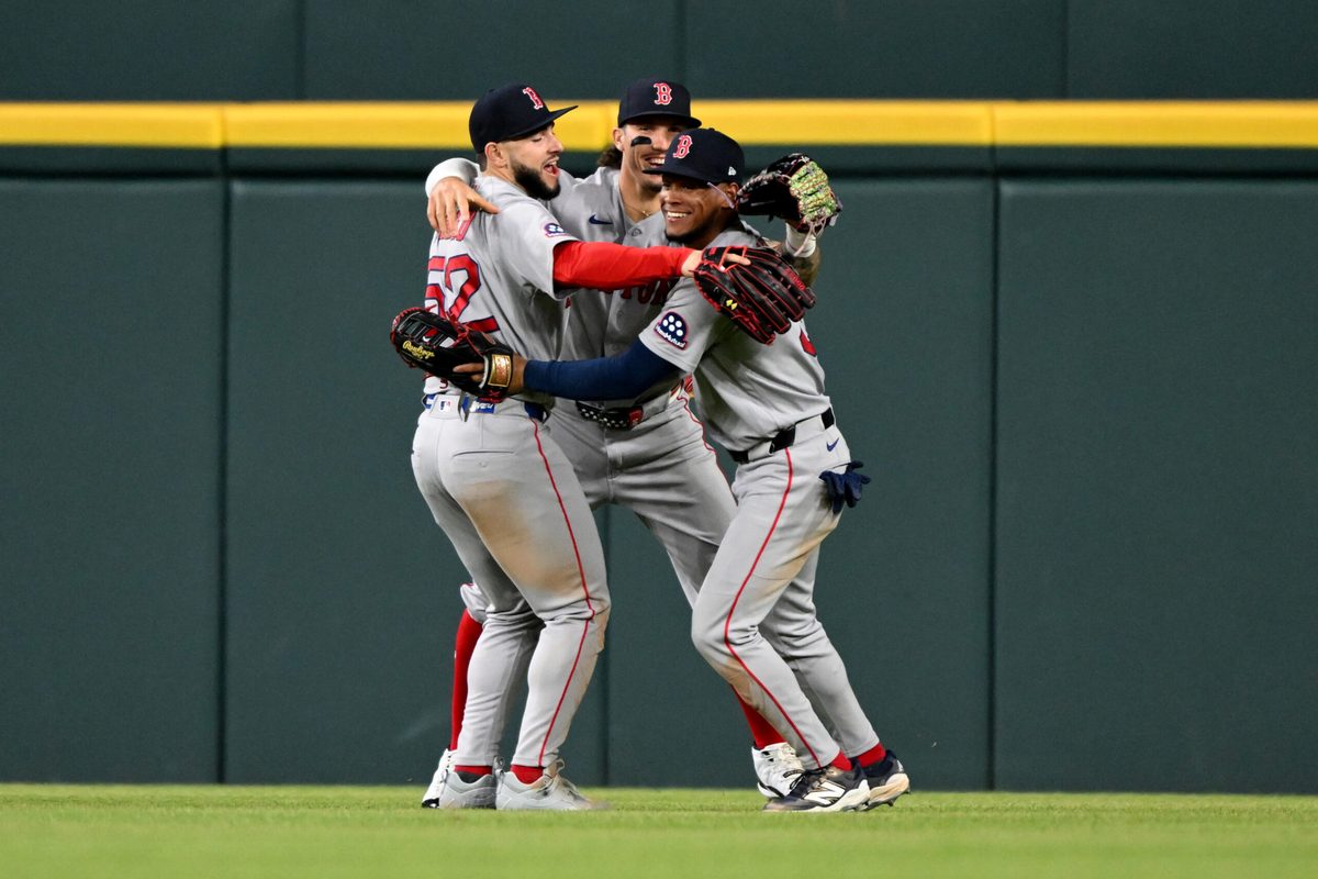 May 5, 2026; Detroit, Michigan, USA; Boston Red Sox outfielders Wilyer Abreu (52), Jarren Duran (16) and Ceddanne Rafaela (3) celebrate their win over the Detroit Tigers at Comerica Park. Mandatory Credit: Lon Horwedel-Imagn Images
