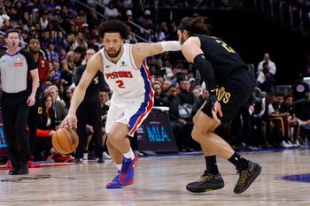May 5, 2026; Detroit, Michigan, USA; Detroit Pistons guard Cade Cunningham (2) dribbles defended by Cleveland Cavaliers guard Max Strus (2) in the second half during game one of the second round of the 2026 NBA Playoffs at Little Caesars Arena. Mandatory Credit: Rick Osentoski-Imagn Images
