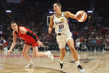 May 3, 2026; Portland, OR, USA;  Los Angeles Sparks guard Kelsey Plum (10) gets control of the ball against Portland Fire forward Bridget Carleton (6) at Moda Center. Mandatory Credit: Jaime Valdez-Imagn Images