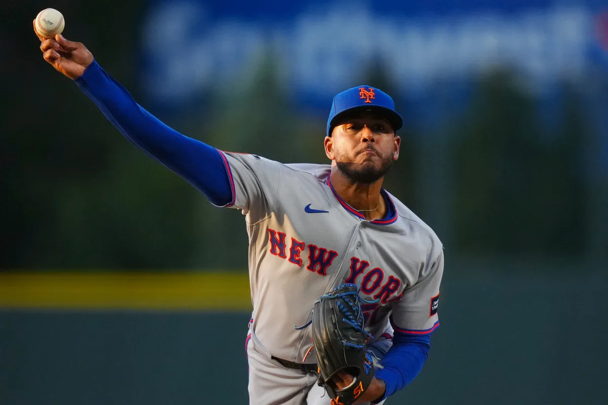 May 6, 2026; Denver, Colorado, USA; New York Mets starting pitcher Freddy Peralta (51) delivers a pitch against the Colorado Rockies in the first inning at Coors Field. Mandatory Credit: Ron Chenoy-Imagn Images