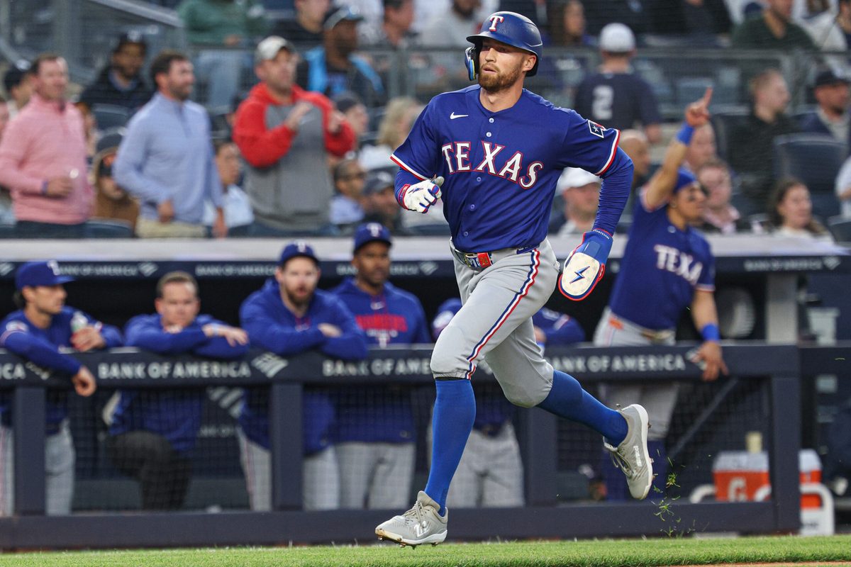 May 6, 2026; Bronx, New York, USA;  Texas Rangers right fielder Brandon Nimmo (24) scores on an RBI double by left fielder Ezequiel Duran (not pictured) during the third inning against the New York Yankees at Yankee Stadium. Mandatory Credit: Vincent Carchietta-Imagn Images