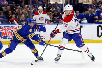 May 6, 2026; Buffalo, New York, USA; Buffalo Sabres center Peyton Krebs (19) tries to block a shot by Montréal Canadiens left wing Juraj Slafkovský (20) during the third period in game one of the second round of the 2026 Stanley Cup Playoffs at KeyBank Center. Mandatory Credit: Timothy T. Ludwig-Imagn Images