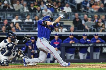 May 6, 2026; Bronx, New York, USA; Texas Rangers shortstop Corey Seager (5) loses his bat while swinging during the sixth inning against the New York Yankees at Yankee Stadium. Mandatory Credit: Vincent Carchietta-Imagn Images