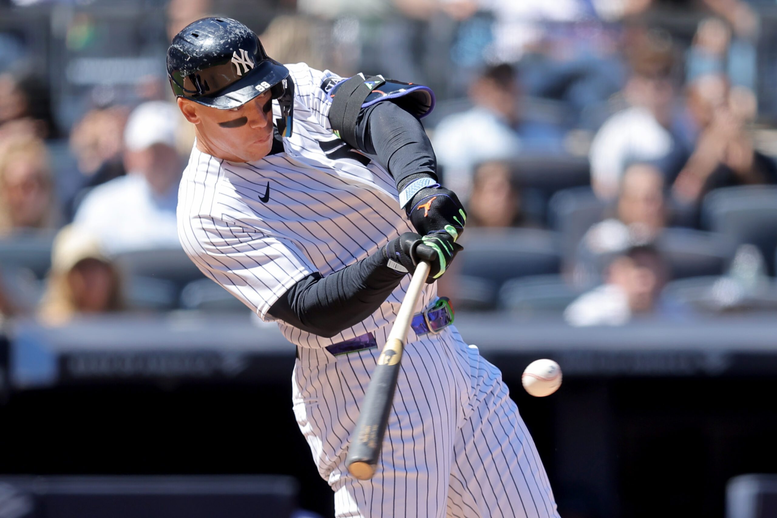 May 7, 2026; Bronx, New York, USA; New York Yankees designated hitter Aaron Judge (99) hits an RBI single against the Texas Rangers during the sixth inning at Yankee Stadium. Mandatory Credit: Brad Penner-Imagn Images
