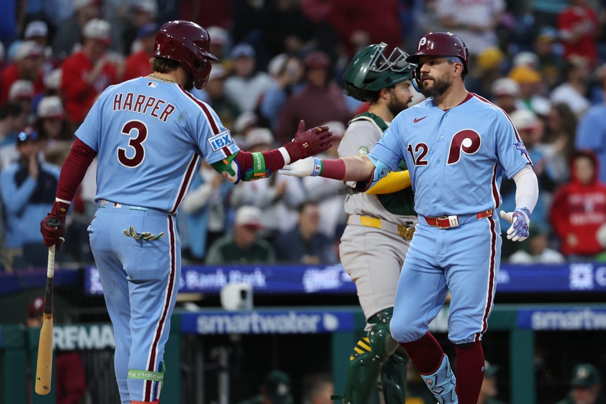 May 7, 2026; Philadelphia, Pennsylvania, USA; Philadelphia Phillies left fielder Kyle Schwarber (12) is congratulated by first baseman Bryce Harper (3) after hitting a home run against the Athletics at Citizens Bank Park. Mandatory Credit: Bill Streicher-Imagn Images
