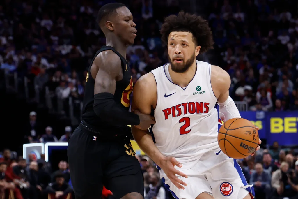 May 7, 2026; Detroit, Michigan, USA; Detroit Pistons guard Cade Cunningham (2) dribbles defended by Cleveland Cavaliers guard Dennis Schroder (8) in the second half during game two of the second round of the 2026 NBA Playoffs at Little Caesars Arena. Mandatory Credit: Rick Osentoski-Imagn Images