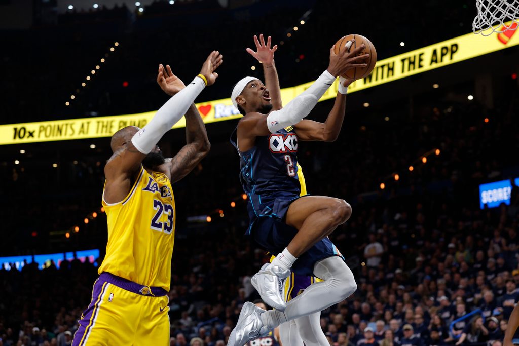 May 7, 2026; Oklahoma City, Oklahoma, USA; Oklahoma City Thunder guard Shai Gilgeous-Alexander (2) goes up for a basket in front of Los Angeles Lakers forward LeBron James (23) in the second half during game two of the second round of the 2026 NBA Playoffs at Paycom Center. Mandatory Credit: Alonzo Adams-Imagn Images