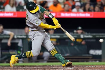 May 8, 2026; Baltimore, Maryland, USA; Athletics catcher Shea Langeliers (23) hits a single during the eighth inning against the Baltimore Orioles at Oriole Park at Camden Yards. Mandatory Credit: Daniel Kucin Jr.-Imagn Images