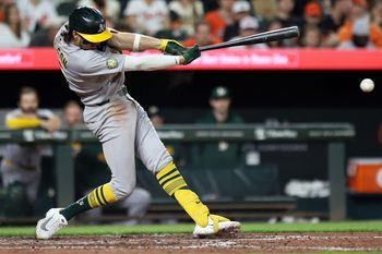 May 8, 2026; Baltimore, Maryland, USA; Athletics shortstop Jacob Wilson (5) hits a RBI single during the eighth inning against the Baltimore Orioles at Oriole Park at Camden Yards. Mandatory Credit: Daniel Kucin Jr.-Imagn Images
