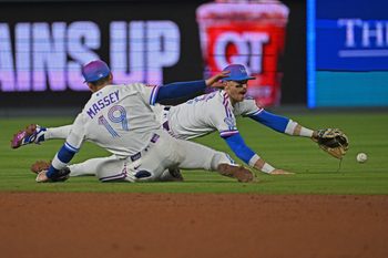 May 8, 2026; Kansas City, Missouri, USA;  Kansas City Royals shortstop Bobby Witt Jr. (7) dives for the ball past second baseman Michael Massey (19) in the eighth inning against the Detroit Tigers at Kauffman Stadium. Mandatory Credit: Peter Aiken-Imagn Images