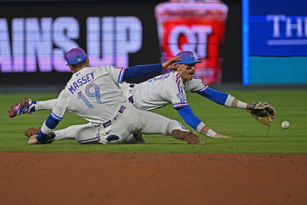 May 8, 2026; Kansas City, Missouri, USA; Kansas City Royals shortstop Bobby Witt Jr. (7) dives for the ball past second baseman Michael Massey (19) in the eighth inning against the Detroit Tigers at Kauffman Stadium. Mandatory Credit: Peter Aiken-Imagn Images