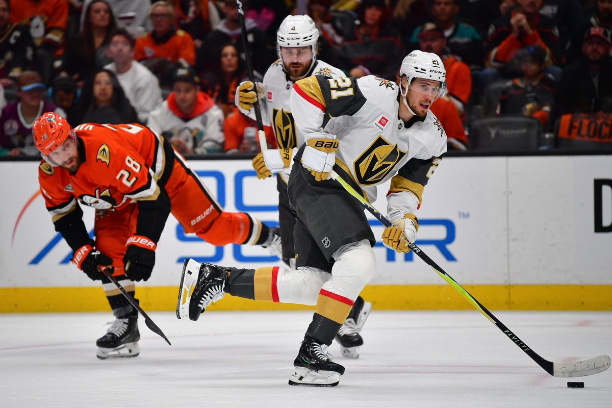 May 8, 2026; Anaheim, California, USA; Vegas Golden Knights center Brett Howden (21) moves the puck ahead of Anaheim Ducks left wing Jeffrey Viel (28) during the second period in game three of the second round of the 2026 Stanley Cup Playoffs at Honda Center. Mandatory Credit: Gary A. Vasquez-Imagn Images